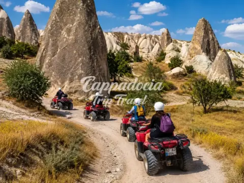ATV riders exploring Cappadocia valleys at sunset